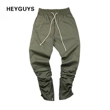 Heyguys ejército pantalones casual flaco cremallera botton solid hip hop calle pantalones pantalones de chándal hombres joggers pantalones adelgazantes(China (Mainland))