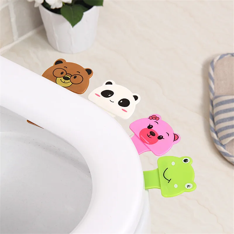 

Toilet Seat Lifters The cartoon closestool lid lifter closets the toilet handle, the hand-held toilet cover fitting covers