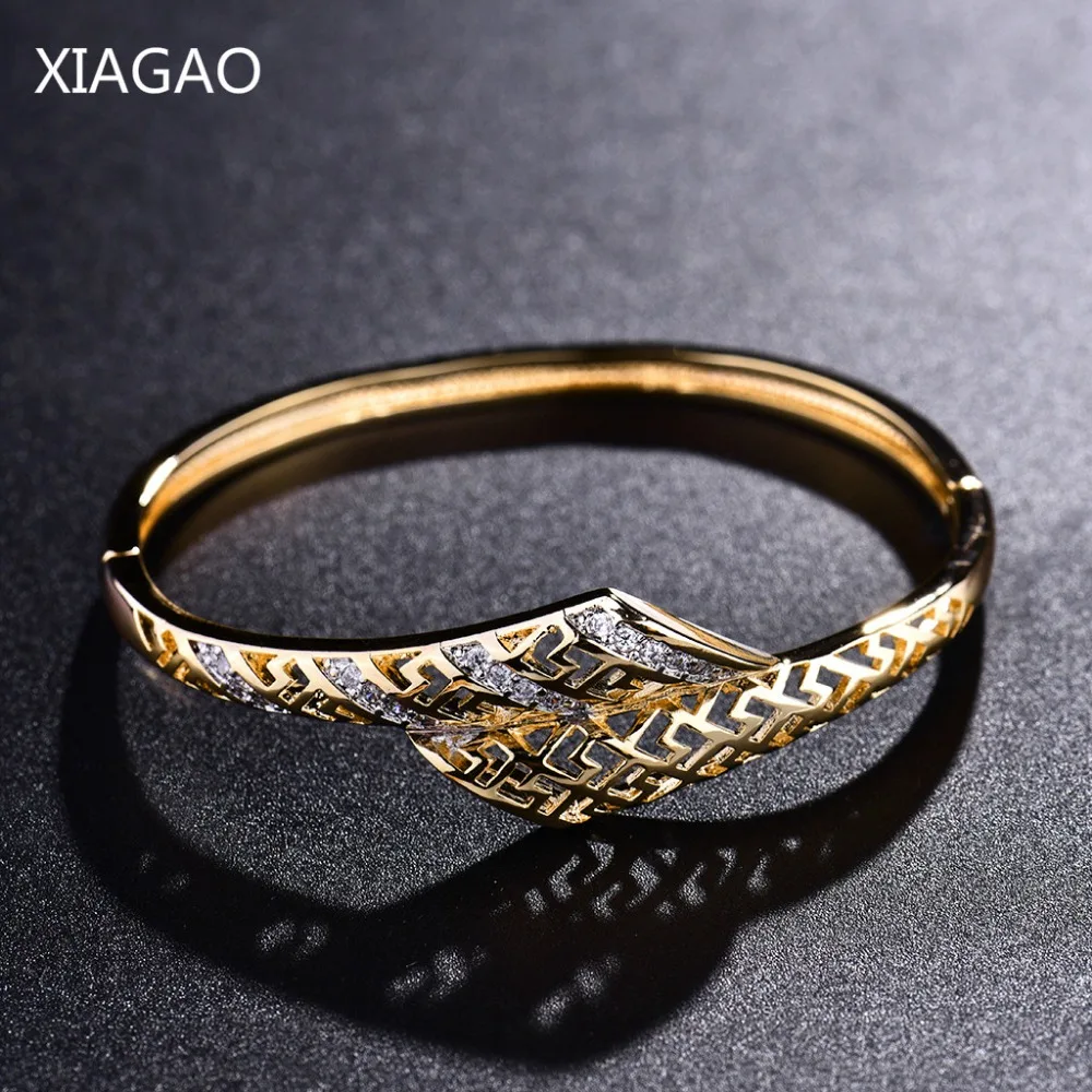 

XIAGAO 2017 New Gold Color Hollow Bracelets & Bangles for Women White Cubic Zirconia Engagement Jewelry Gift Pulseras Handcuffs