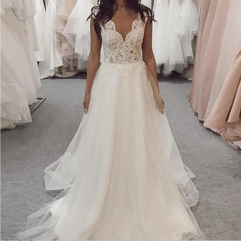 Wedding dress sleeveless A line v neck wedding dress tulle appliques floor length bridal gown white backless robe de mariee Wedding dress sleeveless A line v neck wedding dress tulle appliques floor length bridal gown white backless robe de mariee