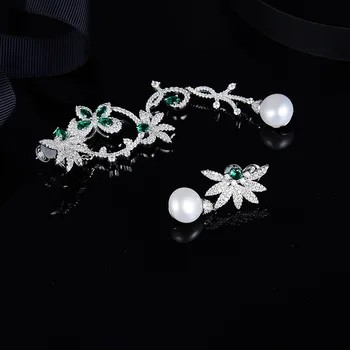 

Ins-APM Freshwater Pearl with Asymmetric Silver Mint Green Drill Butterfly Earrings