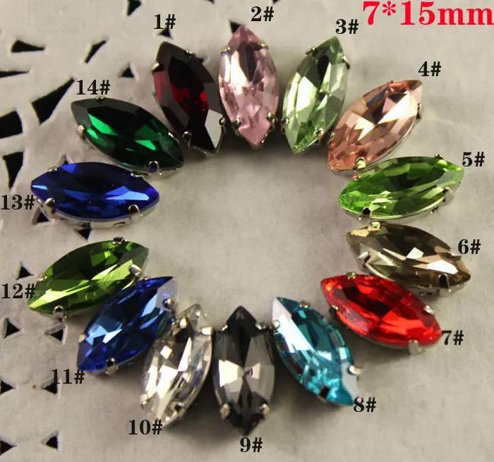 

Free Shipping -52 pcs Assorted colors 7x15mm Shuttle Shape Sew On GLASS Crystals with Silver Plated Brass Metal Base for Garment