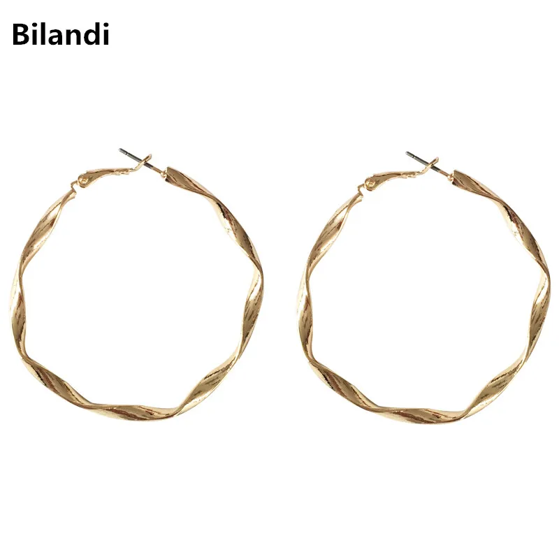 

Metallic circle earring with individual wave patterns simple geometric design female earring