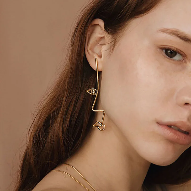 Ассиметричные серьги SRCOI с абстрактным глазом золотого и серебряного цвета