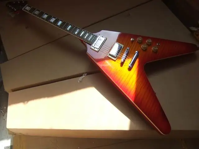 

Wholesale Cibson Flying V Electric guitar, Flying V shape+Body top tiger flame maple, In Cherry All Color are available 101005