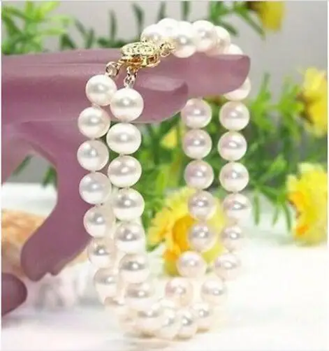 

Free Shipping >>>>> new round 10-11mm natural white south seas pearl bracelet 7.5-8inch14K