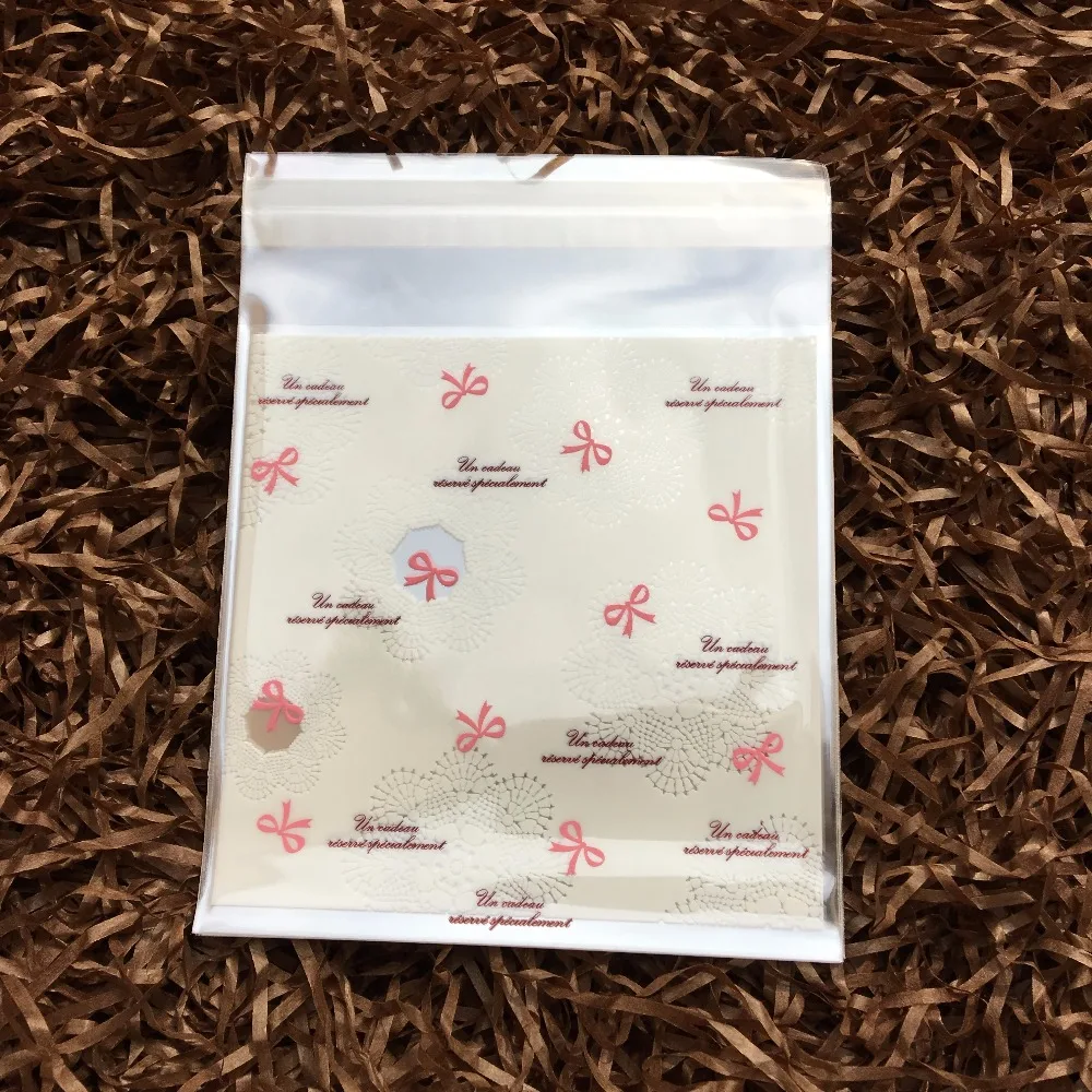 

DONYAMY 100 pcs/lot Mini Bowknot Cake Bag Cookie Packing Plastic Wedding Candy Bag Cake Decorations Party Supplies 10cm*10cm