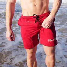 Для мужчин тренажерные залы Фитнес хлопковые шорты перекрестный Бодибилдинг Спортивная одежда для бега тренировки Короткие штаны человек Повседневное модные пляжные тренировочные брюки