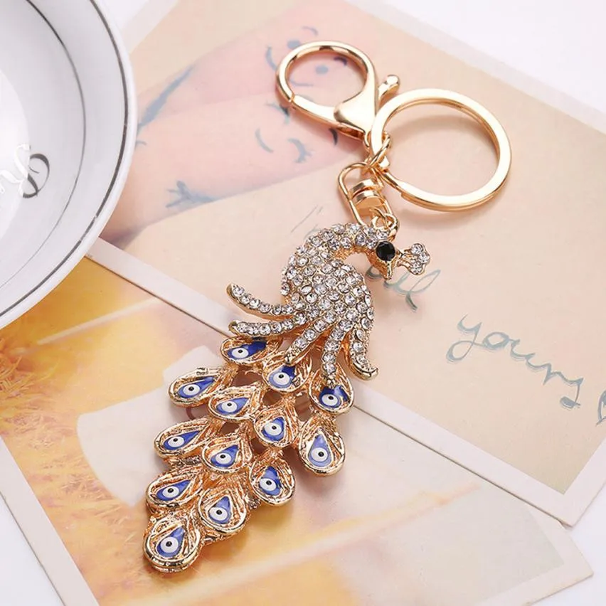 Starry-Styling moda Pavo Real Rhinestone llavero colgante del coche llavero mujeres bolsa llaveros nueva llegada delicada