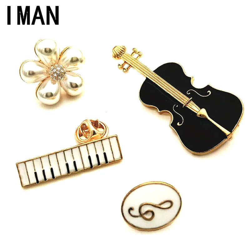 брошь в виде пианино. брошь музыкальные инструменты. музыкальные инструменты великобритании. брошь музыкальные инструменты. виолин голд.