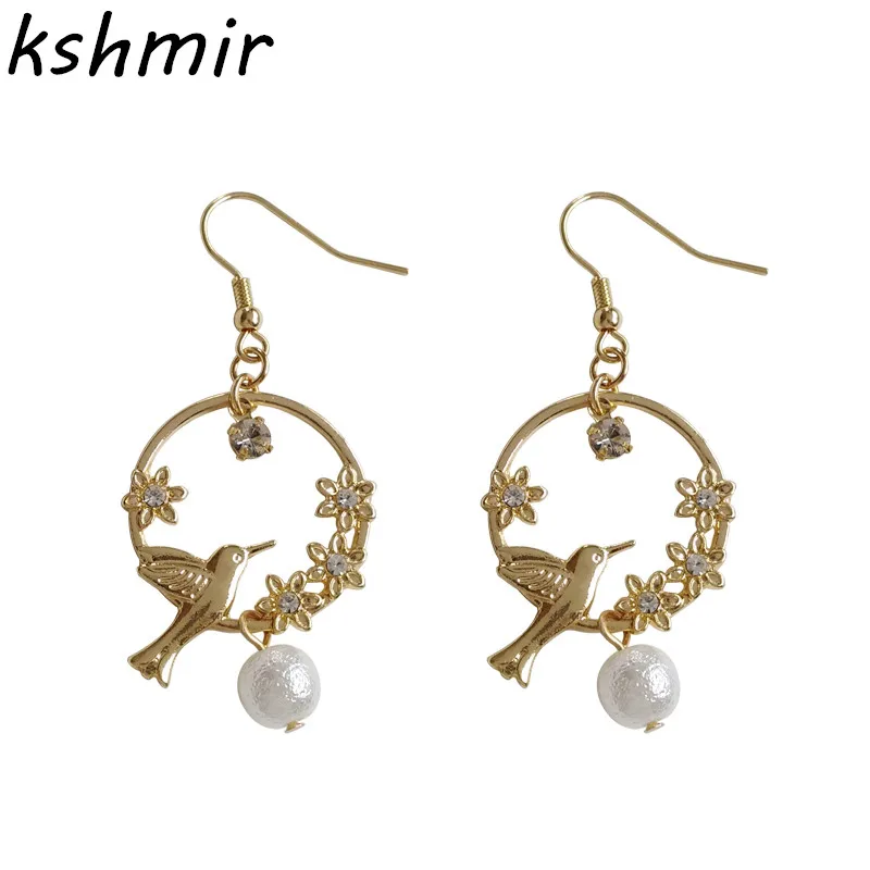 

Literary sakura romantic female temperament pearl earrings bird go on spring outing set auger glow earring Exquisite fashion