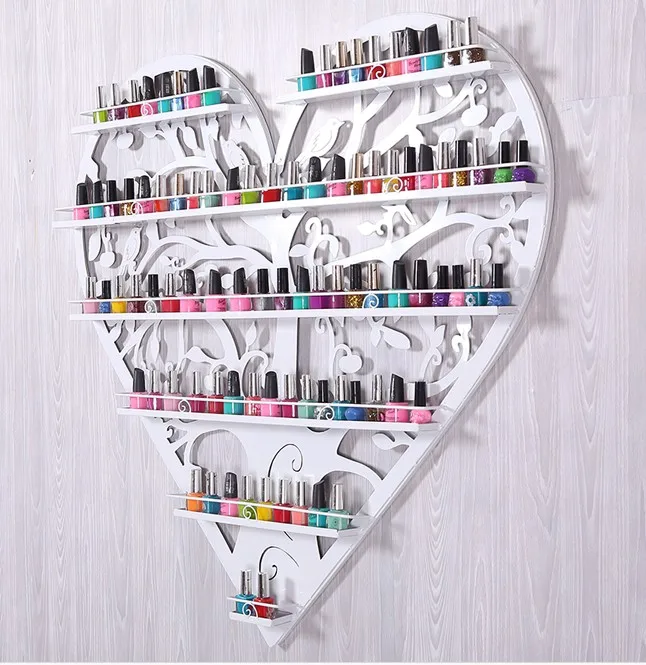 Nail polish store shelves display shelf. Hanging frame, wrought iron heart cosmetics.