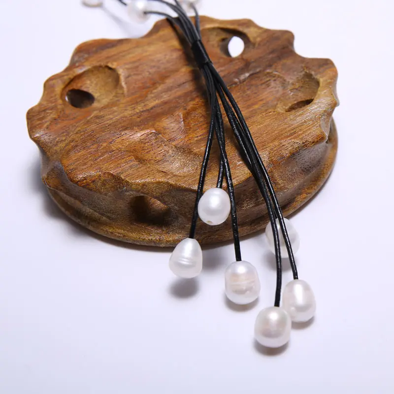Black Leather 10-11 mm String Pearl Necklace 68 cm Long, 5 Star Pendant 10.5 cm Long