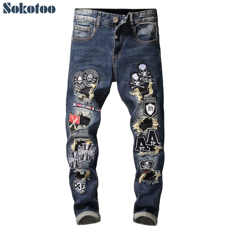 Sokotoo Men's patchwork skull flags patches design stretch jeans Trendy embroidered tapered denim pants Sokotoo Men's patchwork skull flags patches design stretch jeans Trendy embroidered tapered denim pants