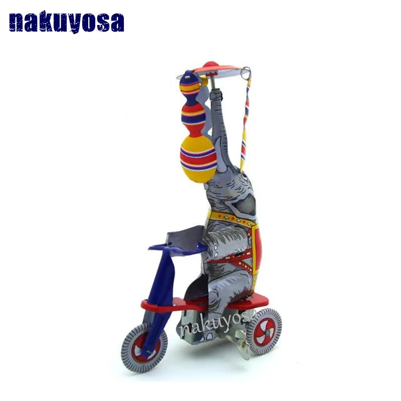 Retro toys Spain styles Elephant riding a tricycle Photography props
