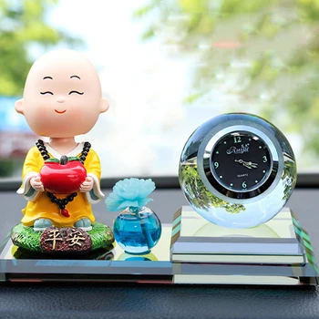 

Vehicle perfume Car perfume accessories Small monk shaking his head Interior decorations Automobile decoration Vehicle clock