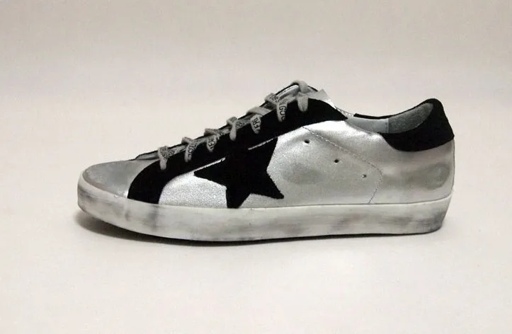 silver and black golden goose sneakers