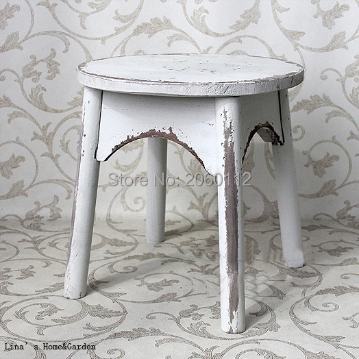 shabby old white round wood stool.jpg