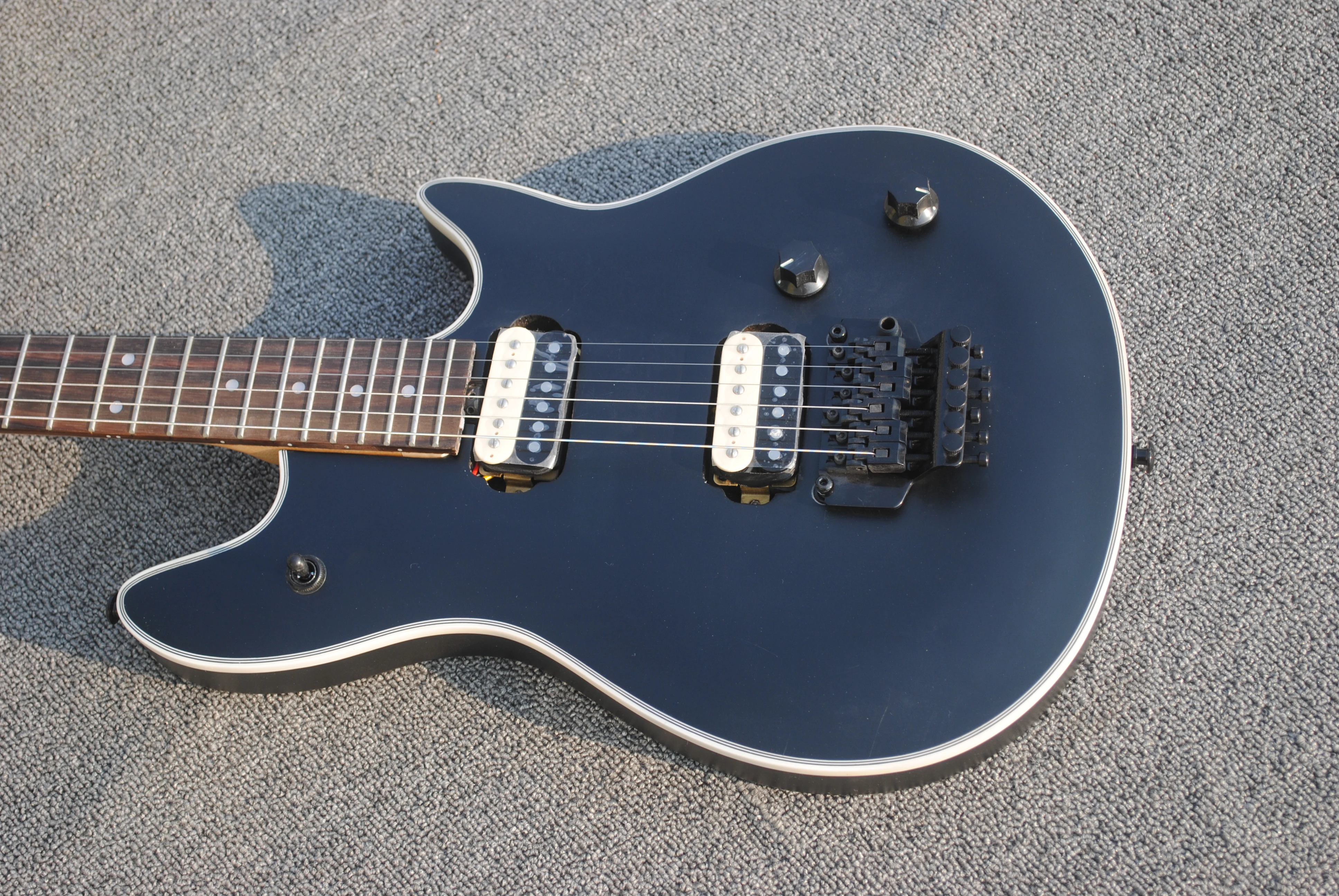 

\Factory custom 6 string electric guitar, bright black body, cream wrap, double swing bridge, free delivery