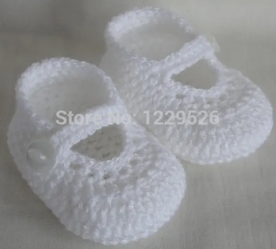 white knitted baby booties