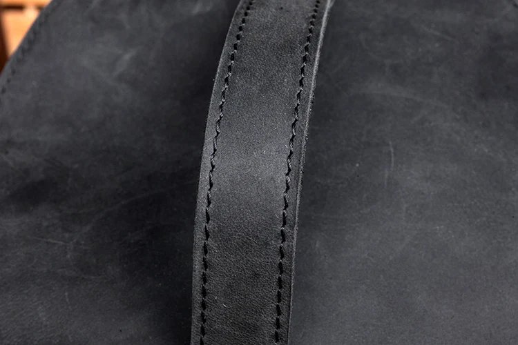 Black Leather Backpack Handstrap Detail
