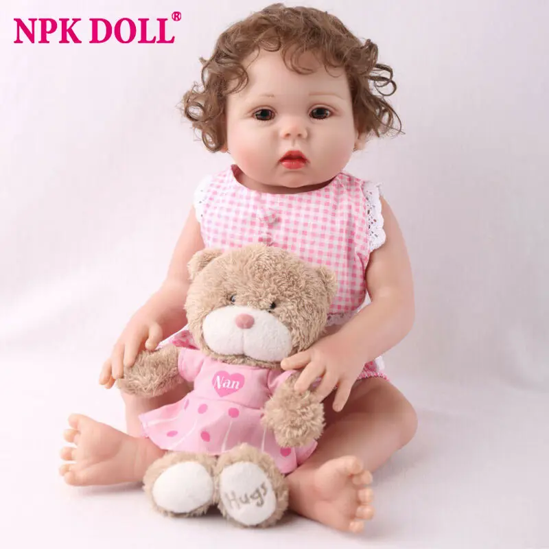 

NPKDOLL Reborn Baby Doll 18 inch Full Body Silicone Handmade Gifts Doll Girl Pink clothes Gift Teddy Bear Curly Hair