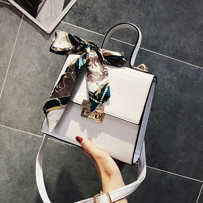 2018 جديد أزياء المرأة مصمم حقيبة يد القوس المحمولة صندوق مربع جودة بو الجلود المرأة حقيبة قفل المراهنات حقيبة الكتف كروسبودي