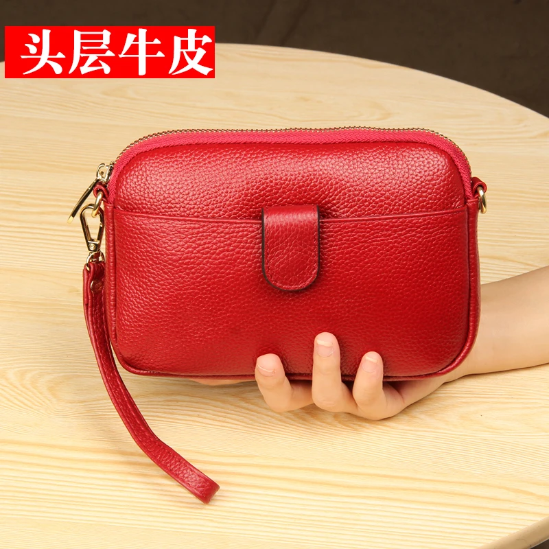 The first layer of leather clutch bag female 2019 new European and American leather large capacity diagonal cross coin purse