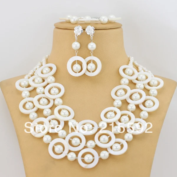 Новый Топ Дизайн белый В виде ракушки жемчуг Бусины комплект ювелирных изделий Свадебные Ювелирные изделия из жемчуга набор люкс Ювелирные... Новый Топ Дизайн белый В виде ракушки жемчуг Бусины комплект ювелирных изделий Свадебные Ювелирные изделия из жемчуга набор люкс Ювелирные...