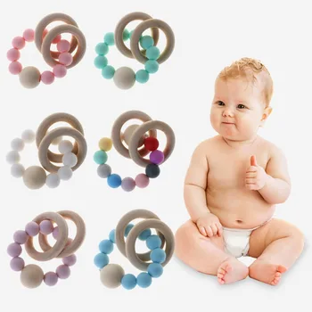 

Baby Teether Bracelet Teething Toys Chew Bite Newborn Teeth Care Beads Jewelry Pain Relief Silicone Wood Rings Infant Supplies M