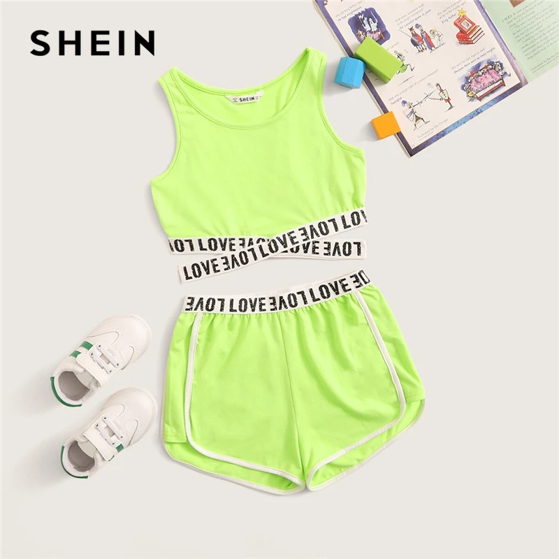 Shein Kiddie Girls Letter Tape Criss Cross Hem Top And Dolphin