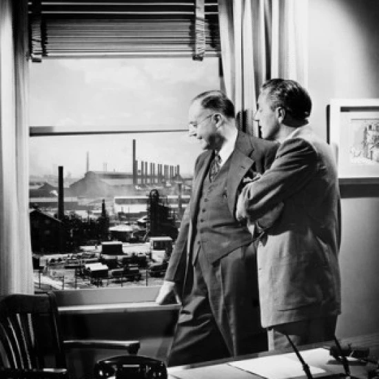 Side profile of two businessmen looking through a window Poster Print (18 x 24)