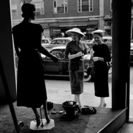 Women looking at window display Poster Print (18 x 24)