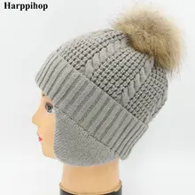 Мода г. детская зимняя енота Мех животных шапки натуральный 13 см шапка с меховым помпоном кепки ушанки натуральный мех шапка для детей