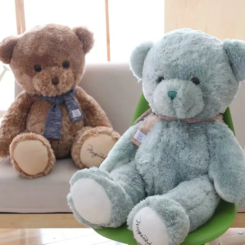 grey teddy bear with patches