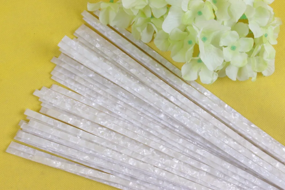 

5 STRIP COFFEE PEARL CELLULOID BINDING,Measures6mm x 1.5mm thick and 1650mm