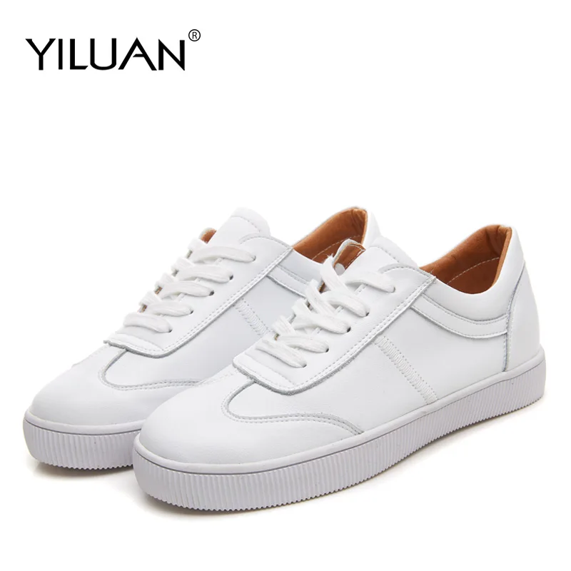 white flat trainers