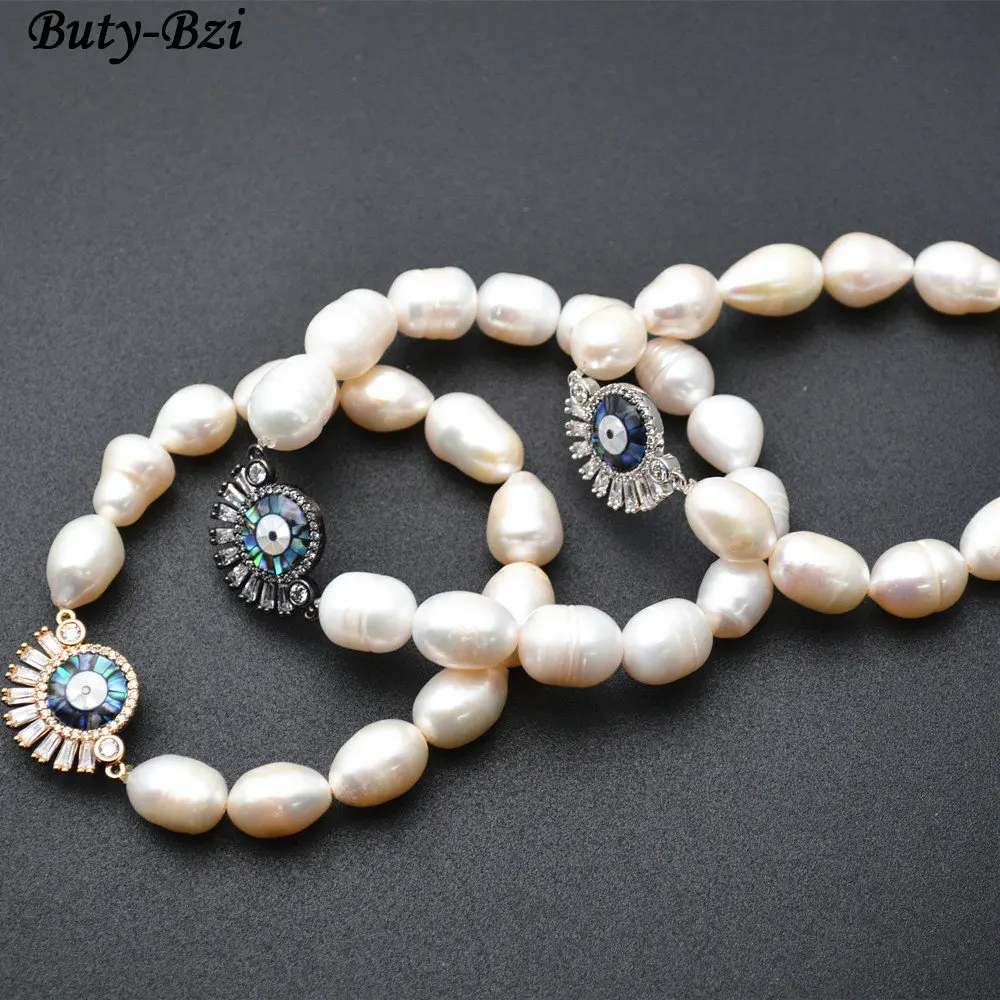 

Beautiful CZ and Abalone Setting Metal Evil Eye Sun Charm Natural white Pearl Potato Beads Elastic Line Bracelet Fashion Jewelry