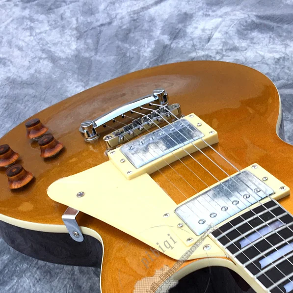 

Free delivery, front gold powder after brown electric guitar, color logo and shape can be customized.