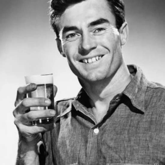 Portrait of a mid adult man holding a drink Poster Print (24 x 36)