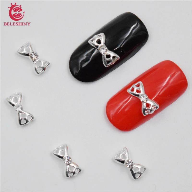 

Beleshiny 50Pcs new Silver bow, 3D Metal Alloy Nail Art Decoration/Charms/Studs,Nails 3d Jewelry nail supplies H098