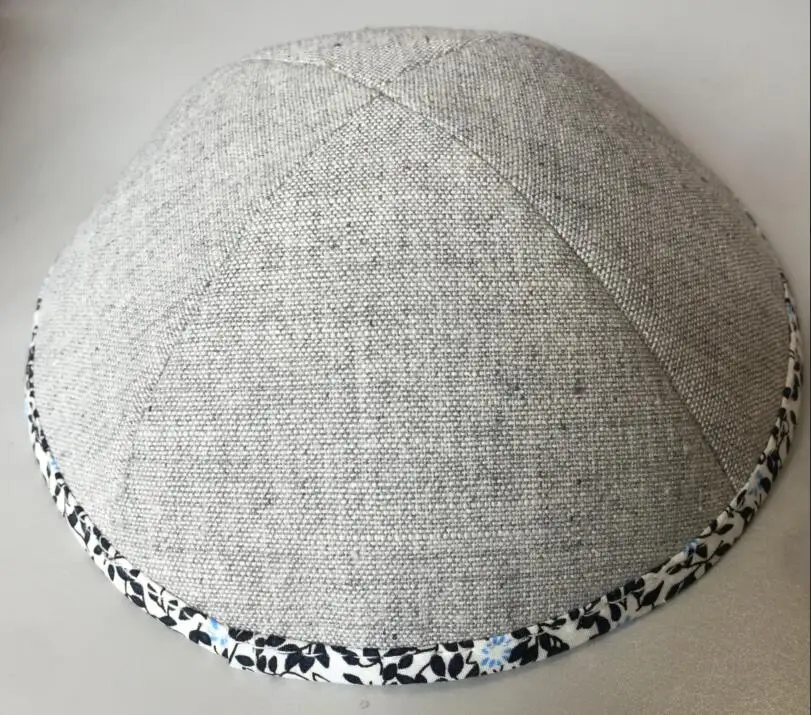 

Light grey heavy linen kippahs with dark grey embroidery logo of JONAS
