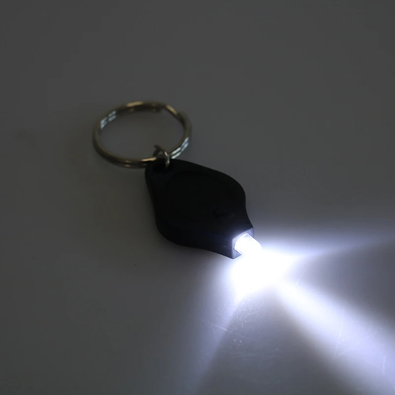 

1pcs Mini Keychain Squeeze Light Outdoor Camping Emergency Key Ring Light Plastic Micro LED Flashlight Torch ABS