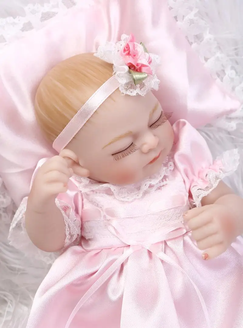 

27CM Silicone reborn dolls miniature baby girl dolls with pretty pink dress pillow wedding gift kids bath toys bonecas