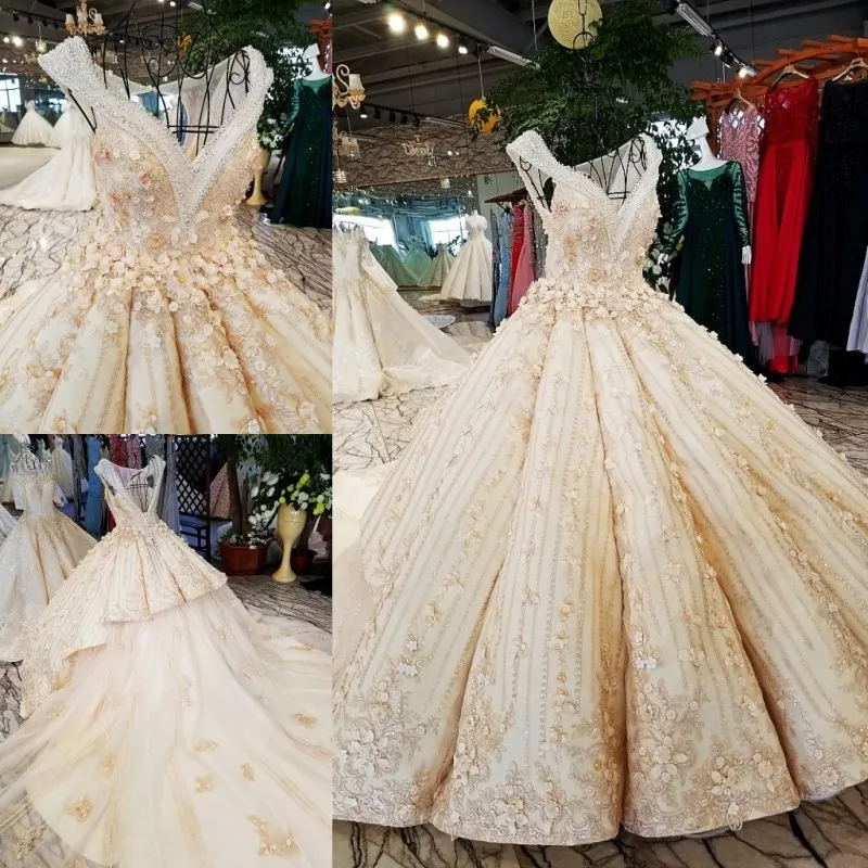 

2018 new wedding dress 100% original and real facotry provide design champagne long sleeves hole back two layers skirt