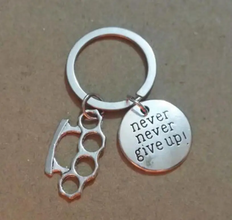 

Never Give Up Brass Knuckle Dusters Metal Alloy Keychain For Keys Car Bag Key Ring Handbag Couple Key Chains Jewelry Men Gifts