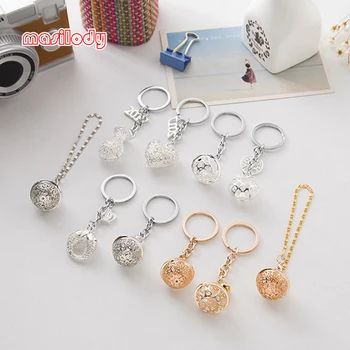 

100pcs/Lot Classic Bell Keychain Hollow Out Bells Key Chain Metal Purse Keychains Tree Heart Keyring Double Fish Crown Keychains
