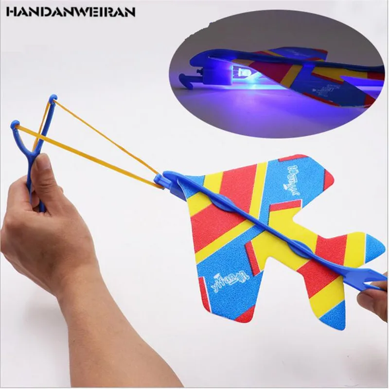 

New 1pcs hot Elastic flash aircraft Glow Ejection Arrow Flying toy kids toys interesting luminous toys Factory direct