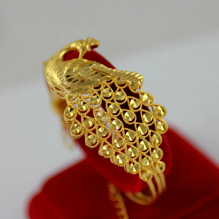 Женский браслет в виде павлина из желтого золота
