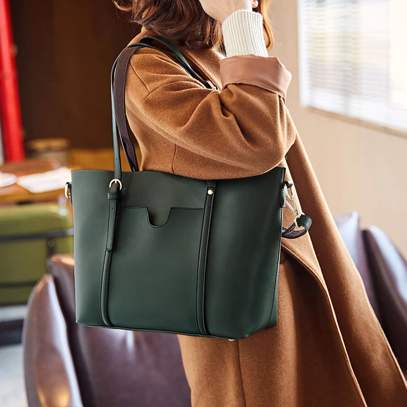 Simple and beautiful Genuine Leather duffle bag New belt decoration women handbags Fashion wild spring and summer shopping bags